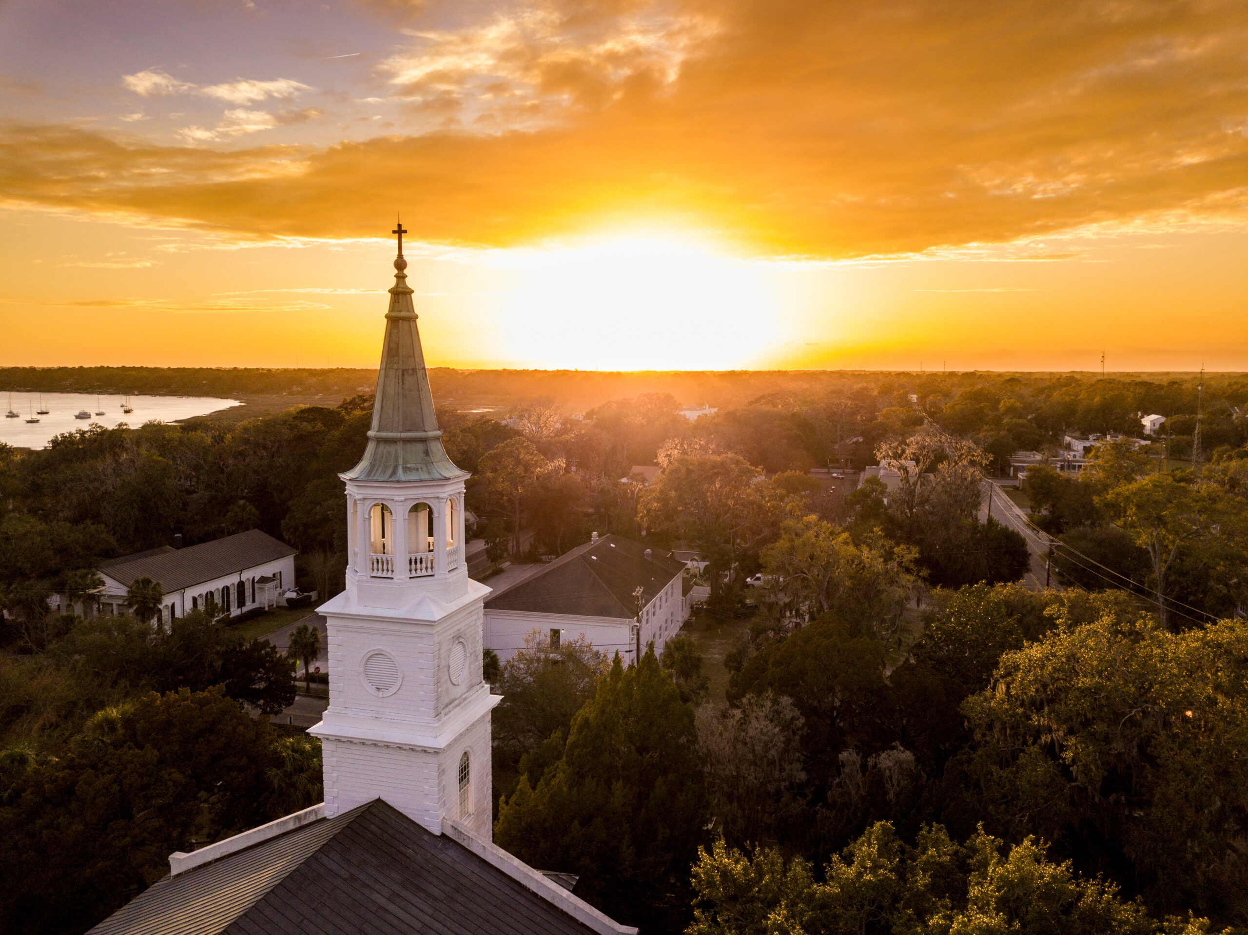 Aerial view of historic church steeple and sunset in Beaufort, South Carolina. Qualified Charitable Distributions
